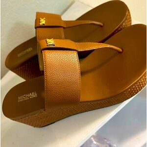 Michael Kors wedge heel sandals. Comfortable goes well with any outfit.